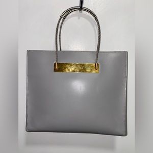 Balenciaga silver and gold fixture. Used.